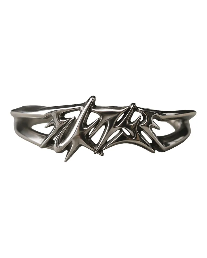 Silver ring shaped like the FCKNYE Festival logo