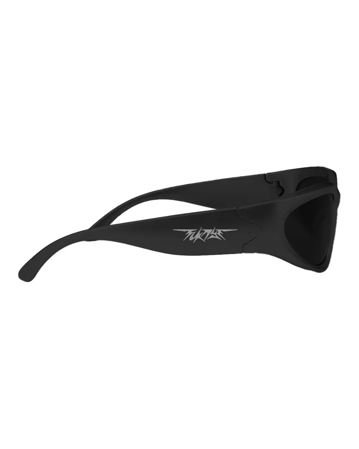 Black wraparound sunglasses seen from the left · white FCKNYE Festival logo on the arm
